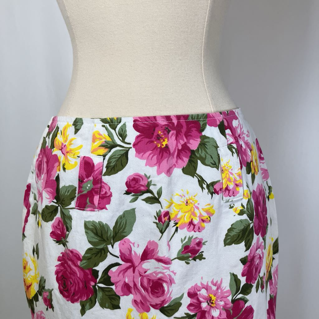 Floral skirt on a mannequin against a plain background