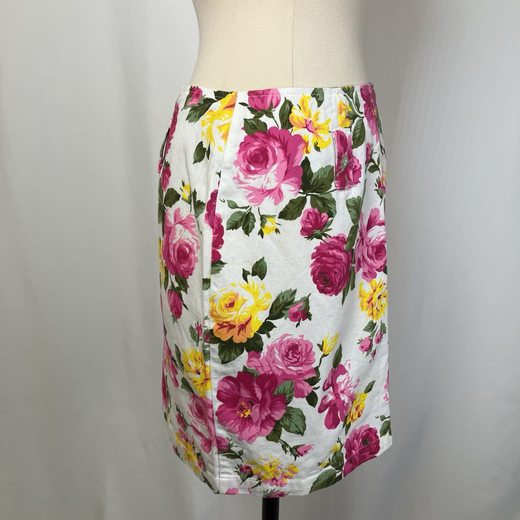 Floral skirt on a mannequin against a plain background