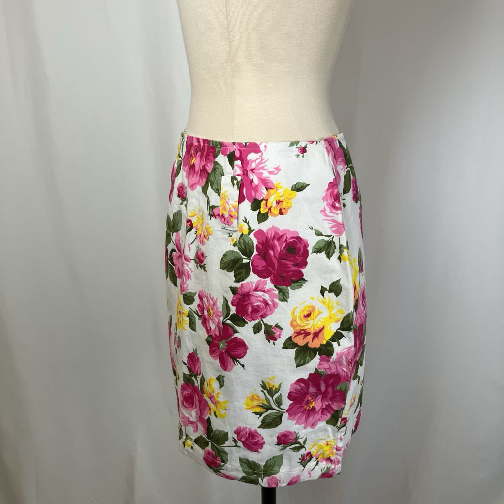 Floral skirt on a mannequin against a plain background