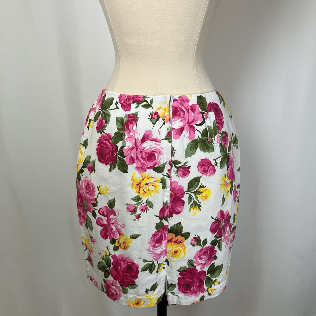 Floral skirt on a mannequin against a plain background