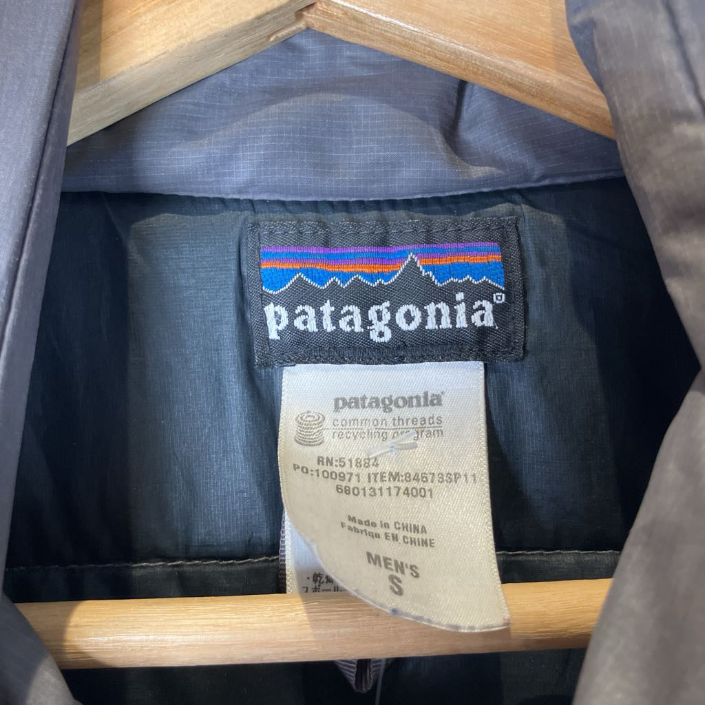 Close-up of Patagonia clothing with brand label on a wooden hanger