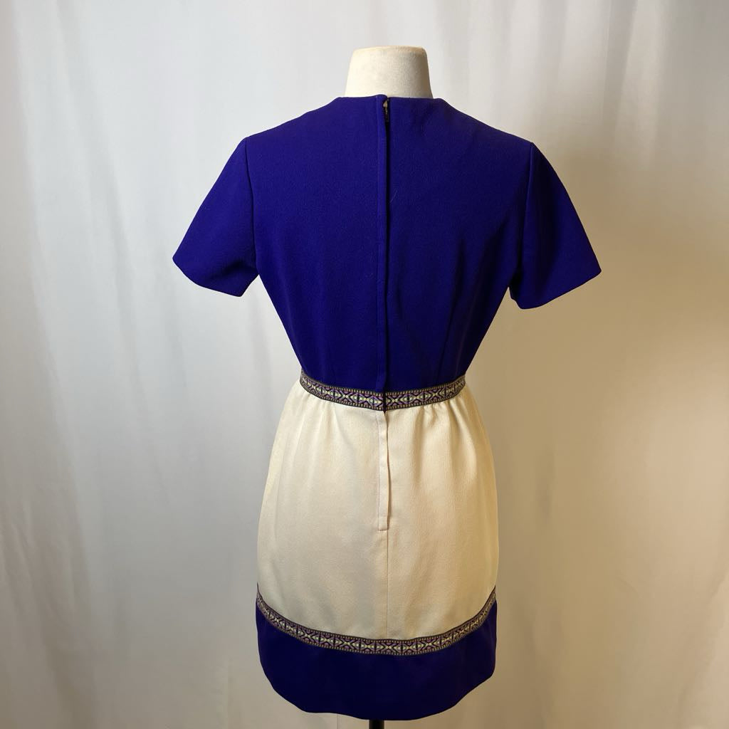 Two-tone dress with blue top and beige bottom on a mannequin against a white background