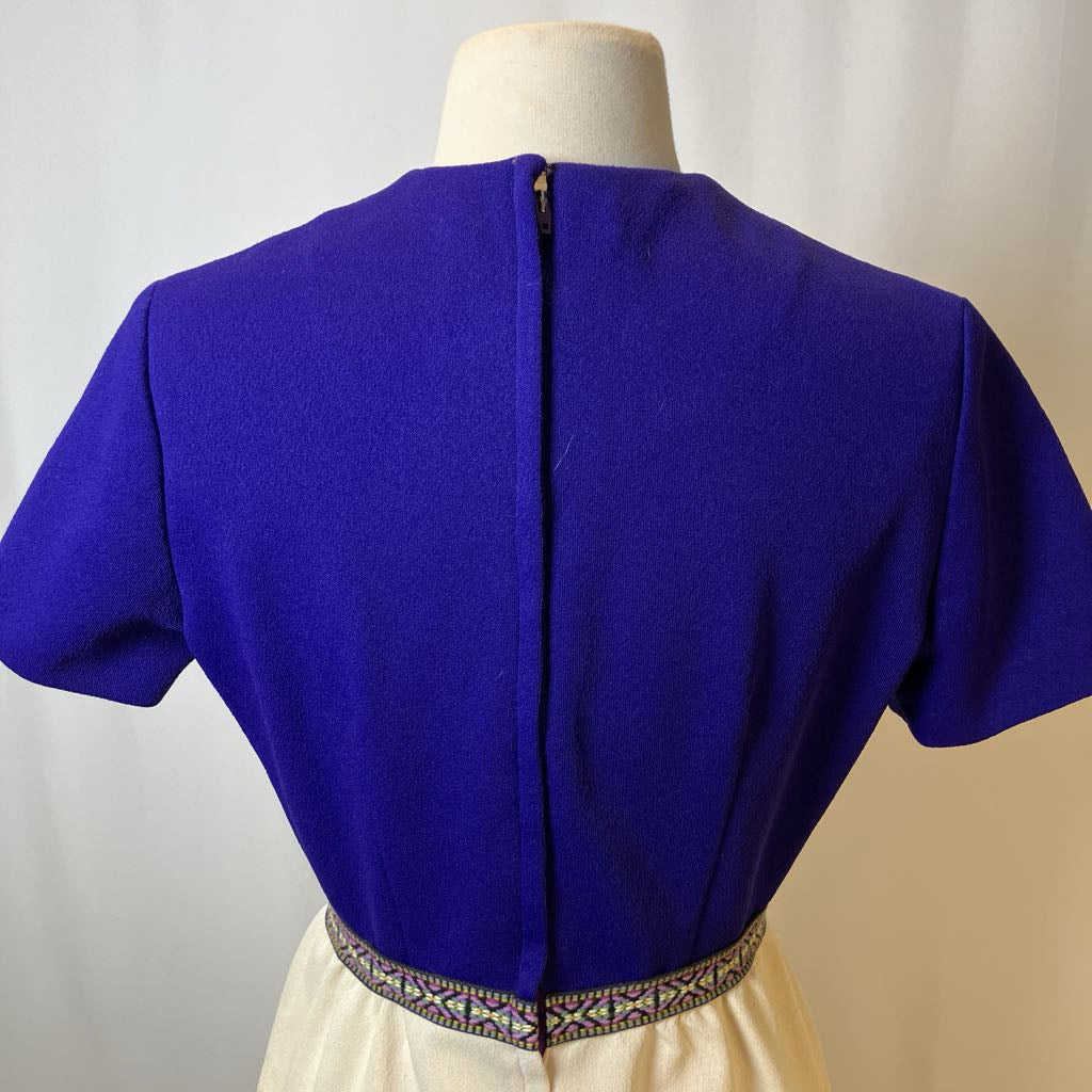 Blue blouse on a mannequin with a plain background