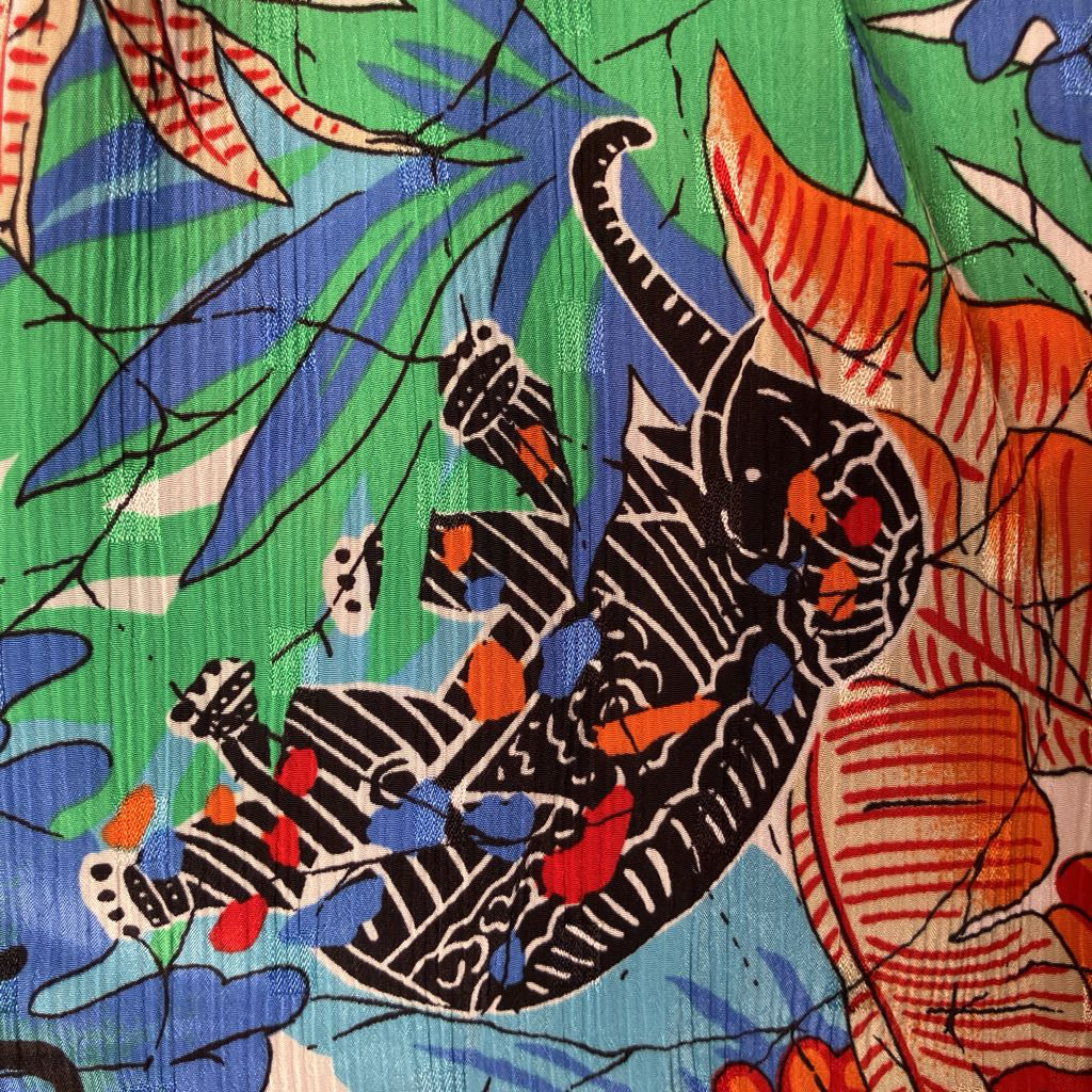 Colorful fabric with a tiger and leaf pattern