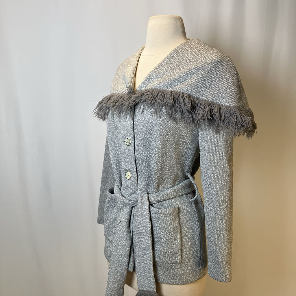 Gray textured coat with feathered trim on a mannequin against a neutral background