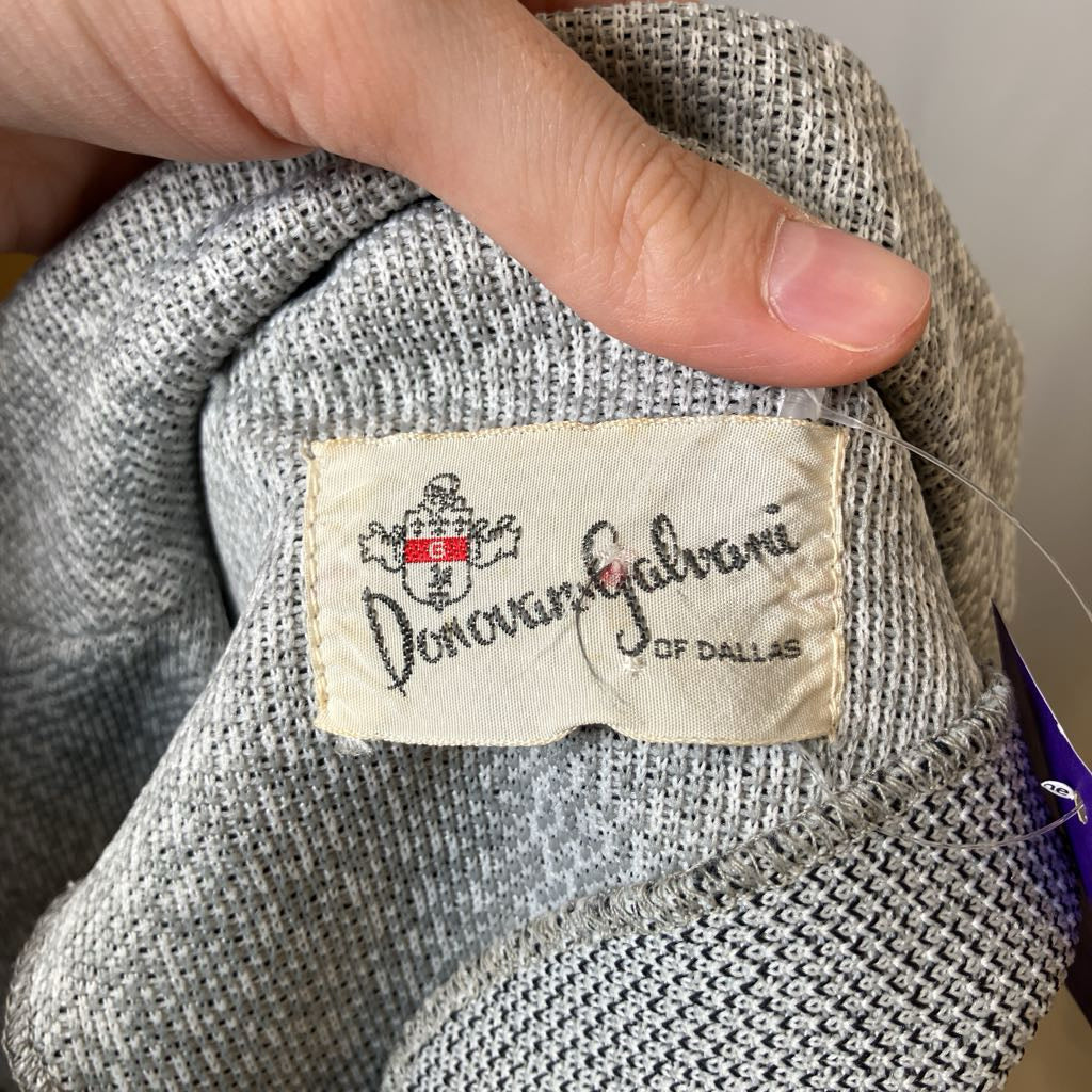 Close-up of a Donovan Galvani label on a textured fabric item.