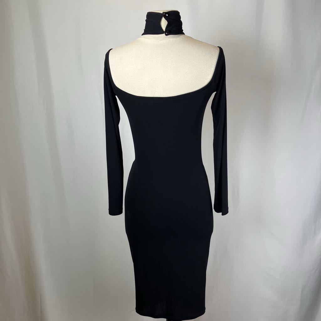 Black dress on a mannequin against a white background