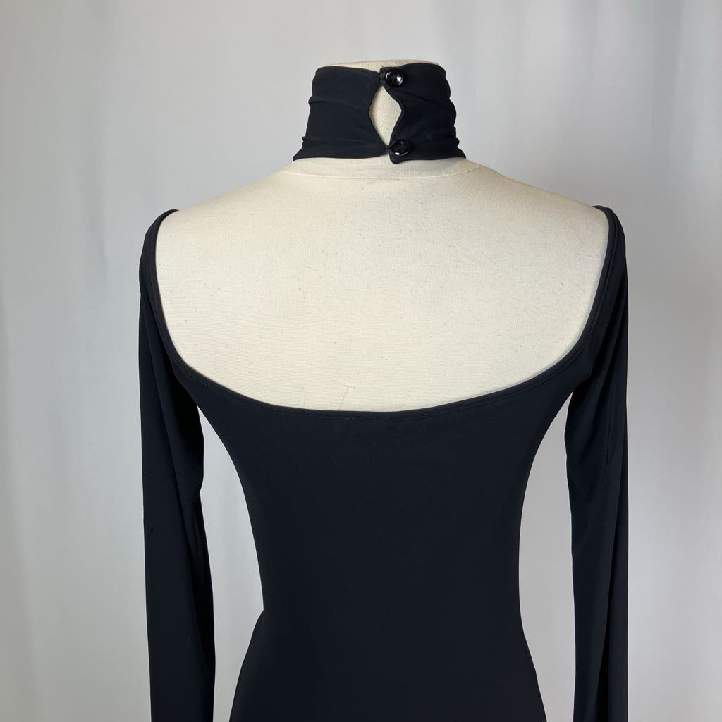 Black dress on a mannequin with a plain background