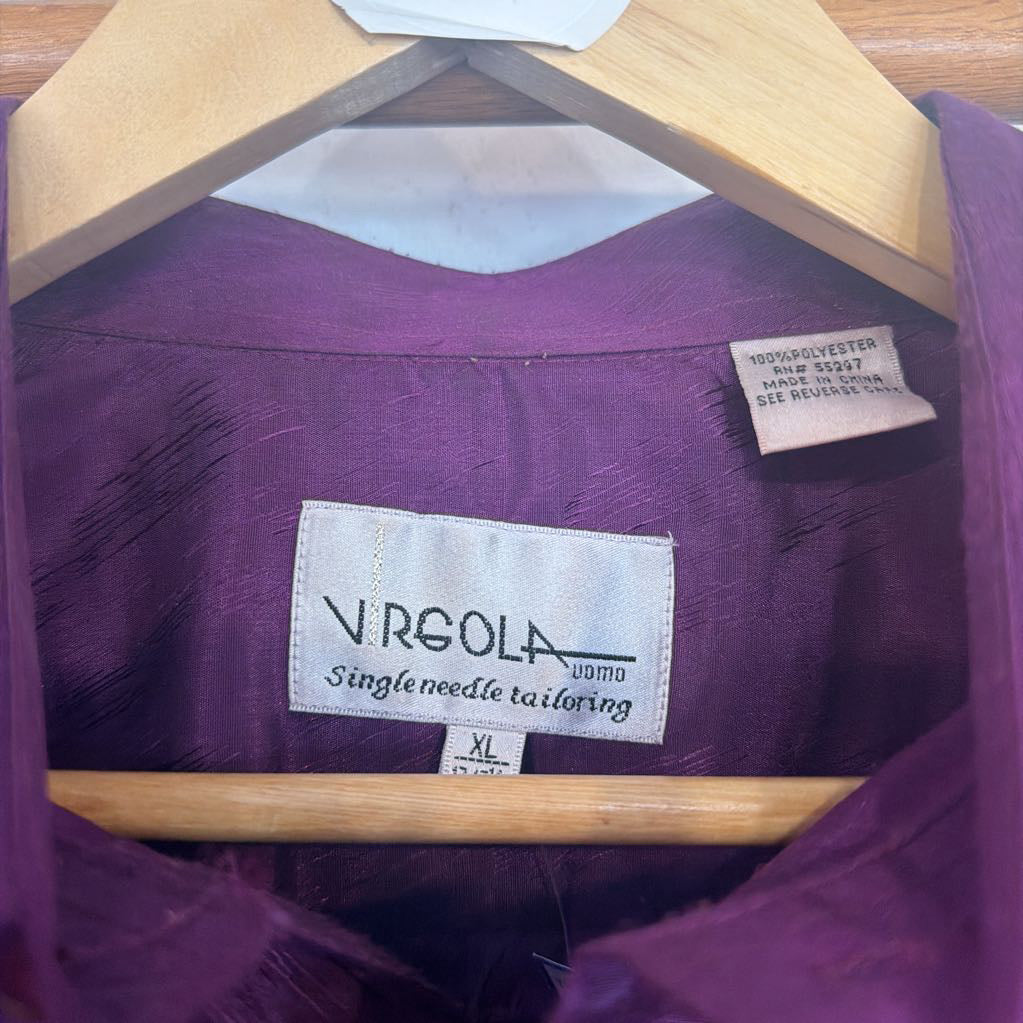 Purple garment with 'Vergola' label on a wooden hanger