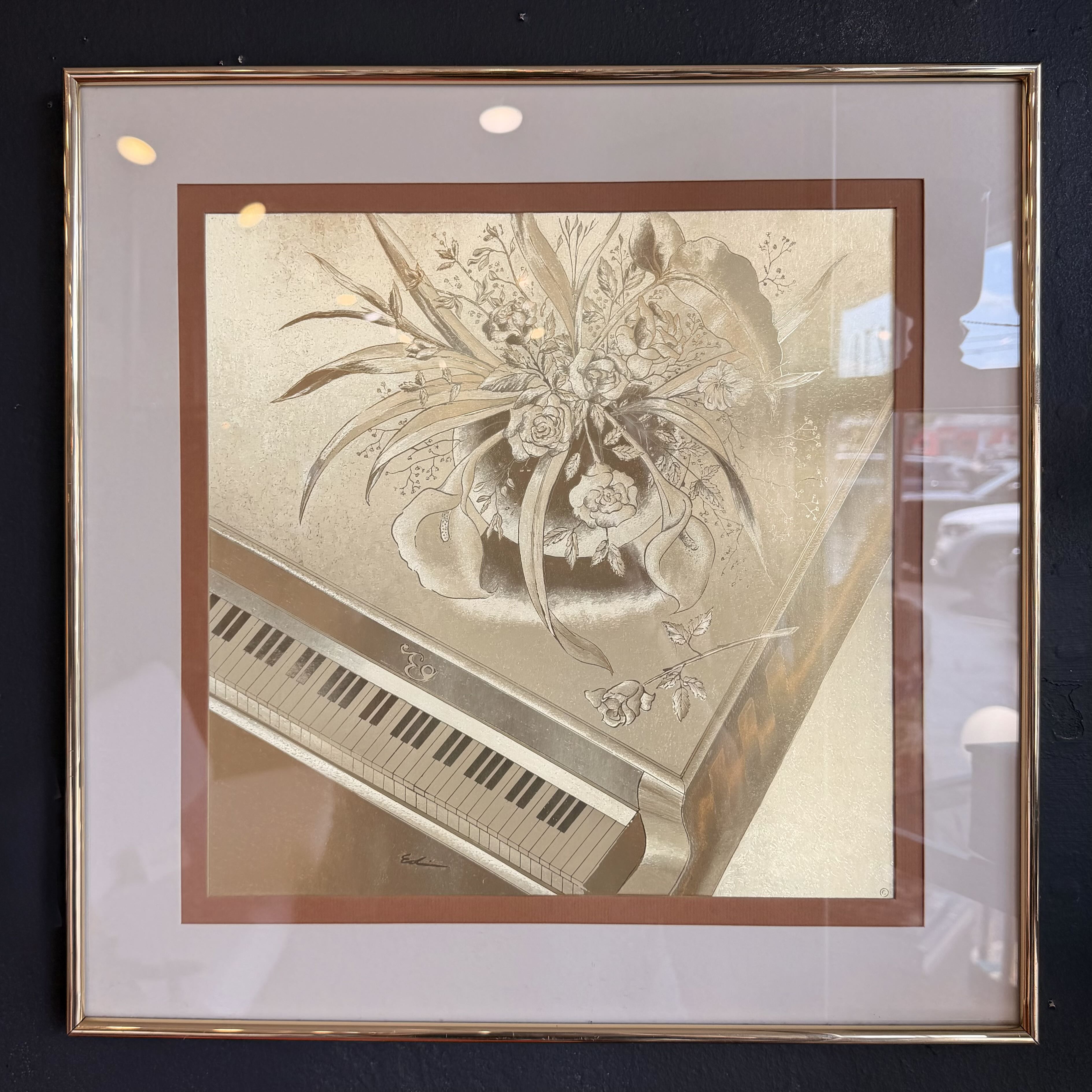art decor of bronze gold piano with flowers on top