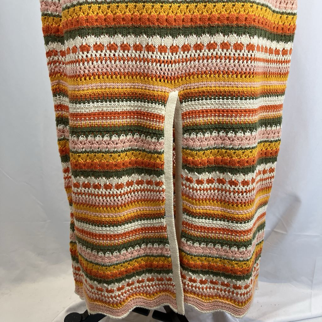 Multicolored striped crochet blanket on a white background