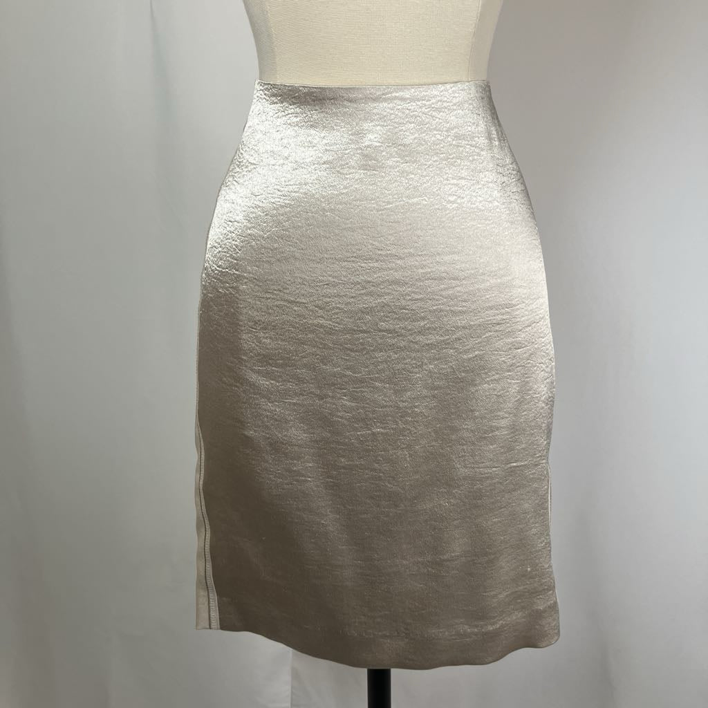 Silver metallic pencil skirt on a mannequin against a plain background
