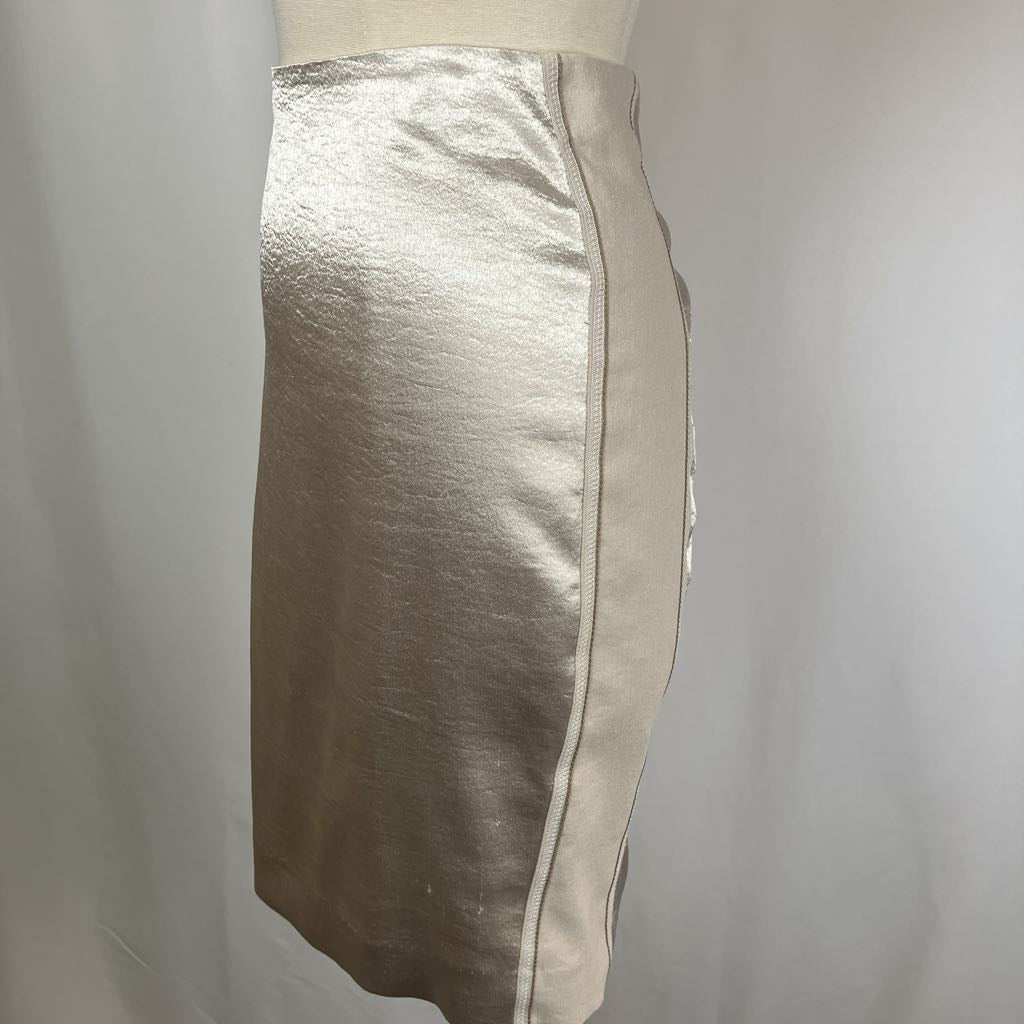 Silver metallic pencil skirt on a mannequin against a plain background