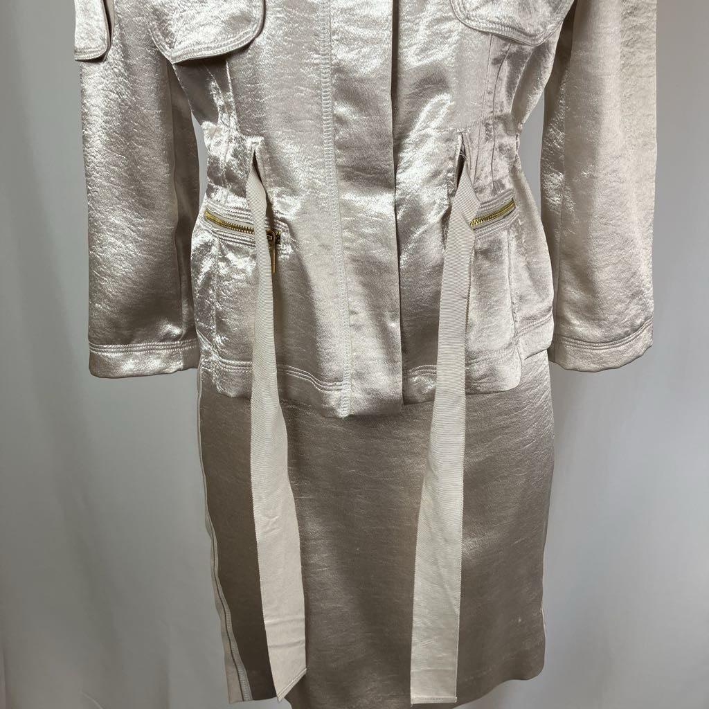 Silver metallic jumpsuit on a plain background