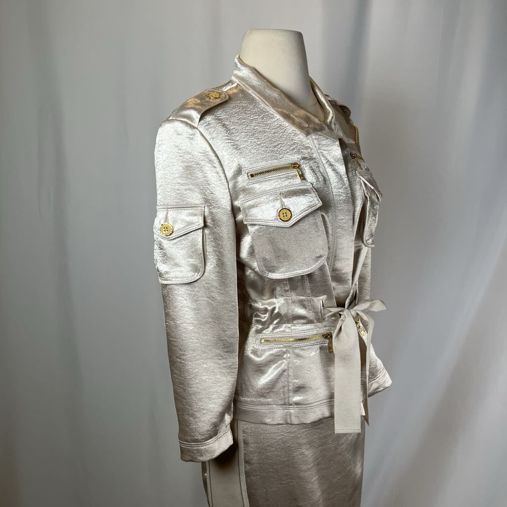 Silver metallic jacket on a mannequin against a plain background