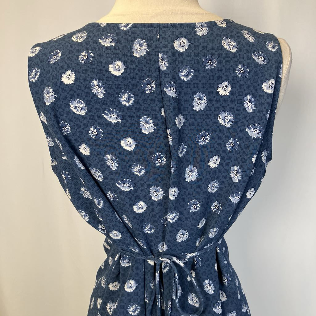Blue floral dress on a mannequin against a plain background