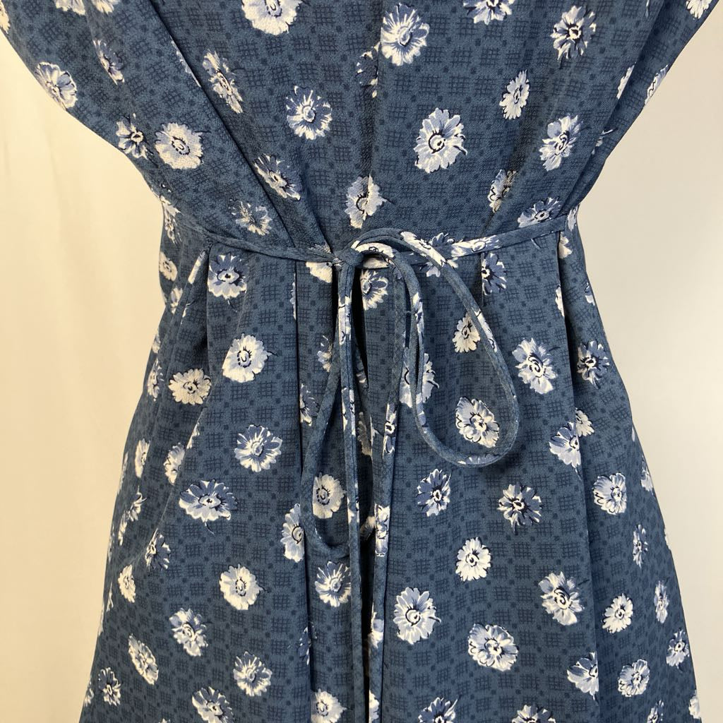 Blue floral dress with a beige background