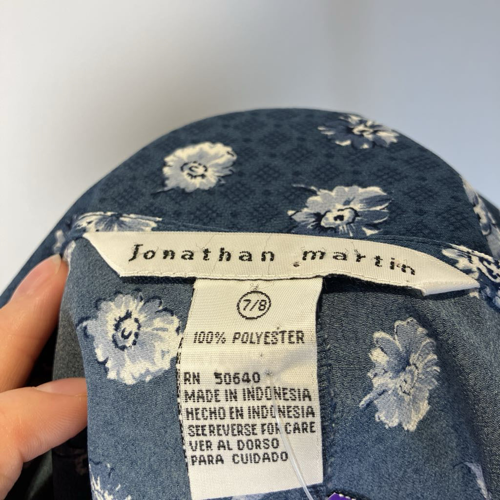 Floral-patterned fabric with a 'Jonathan Martin' label on a white background