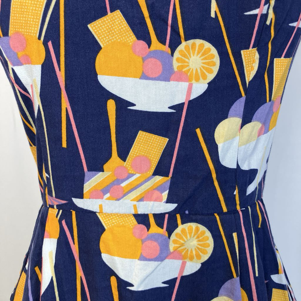 Closeup of design on the dress with a simple white background
