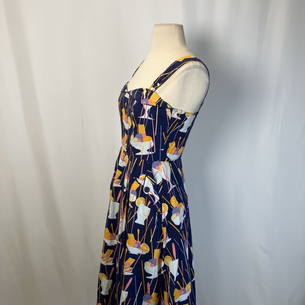 Dress with abstract pattern on a mannequin against a plain background