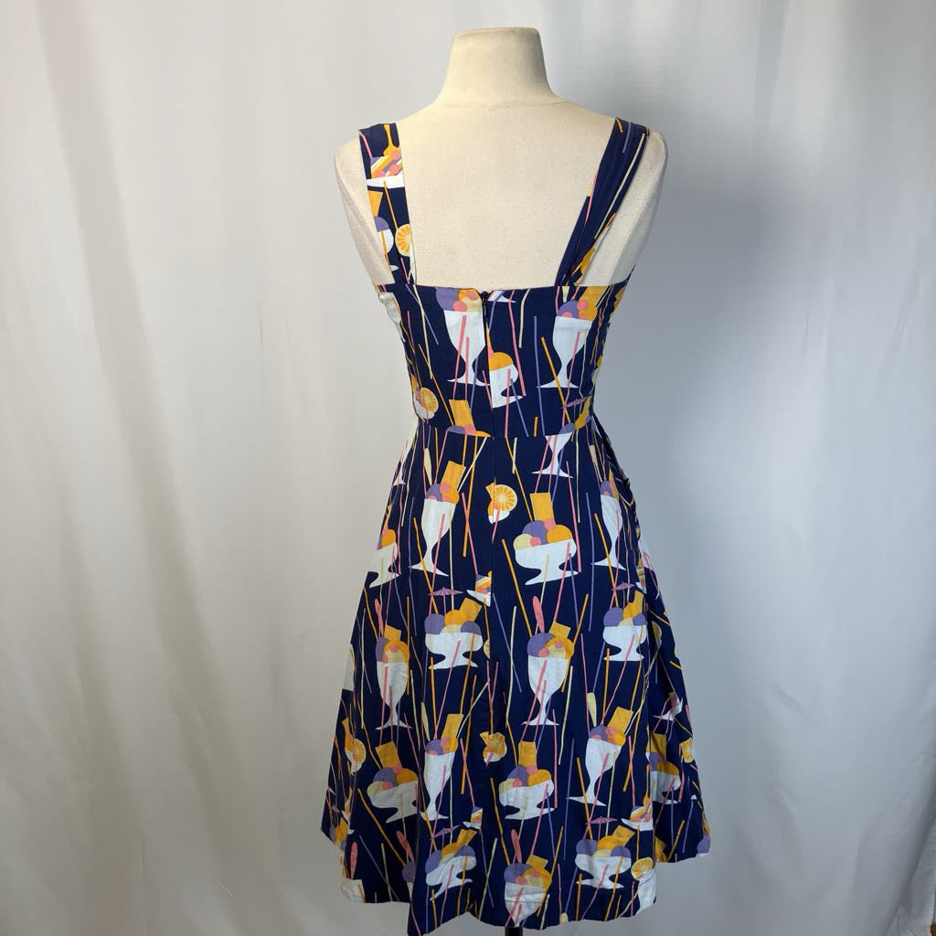 Picture showing back of the abstract print dress with simple white background