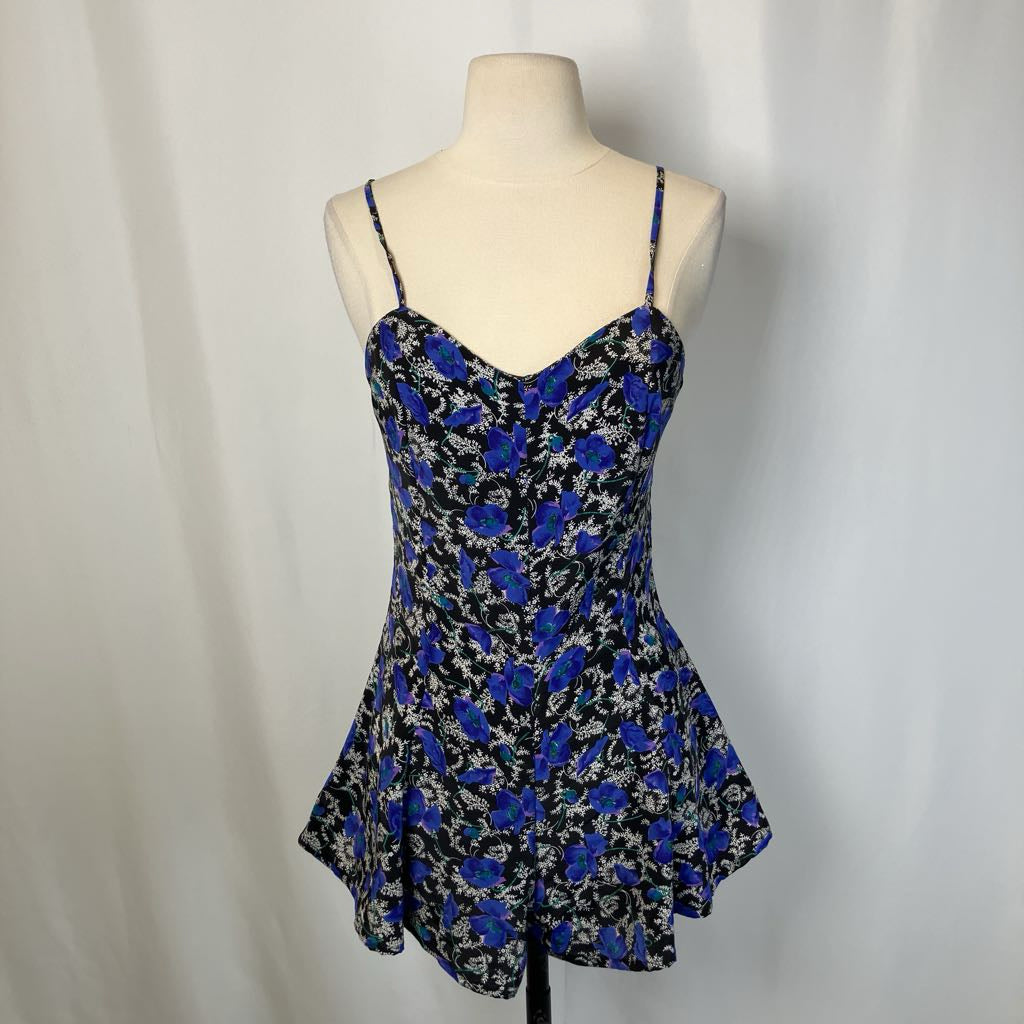 Blue and black dress on mannequin with a simple white background