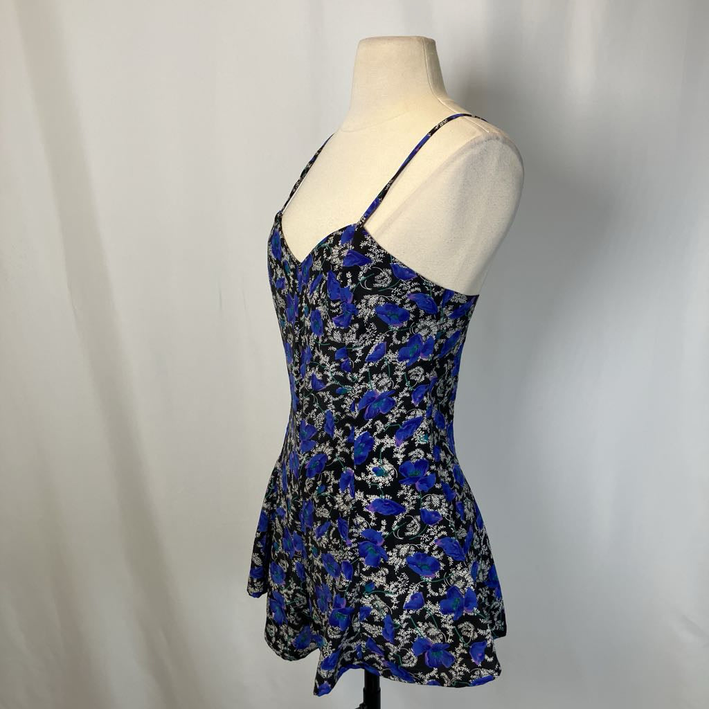 Image of the dress with blue and black design on simple background