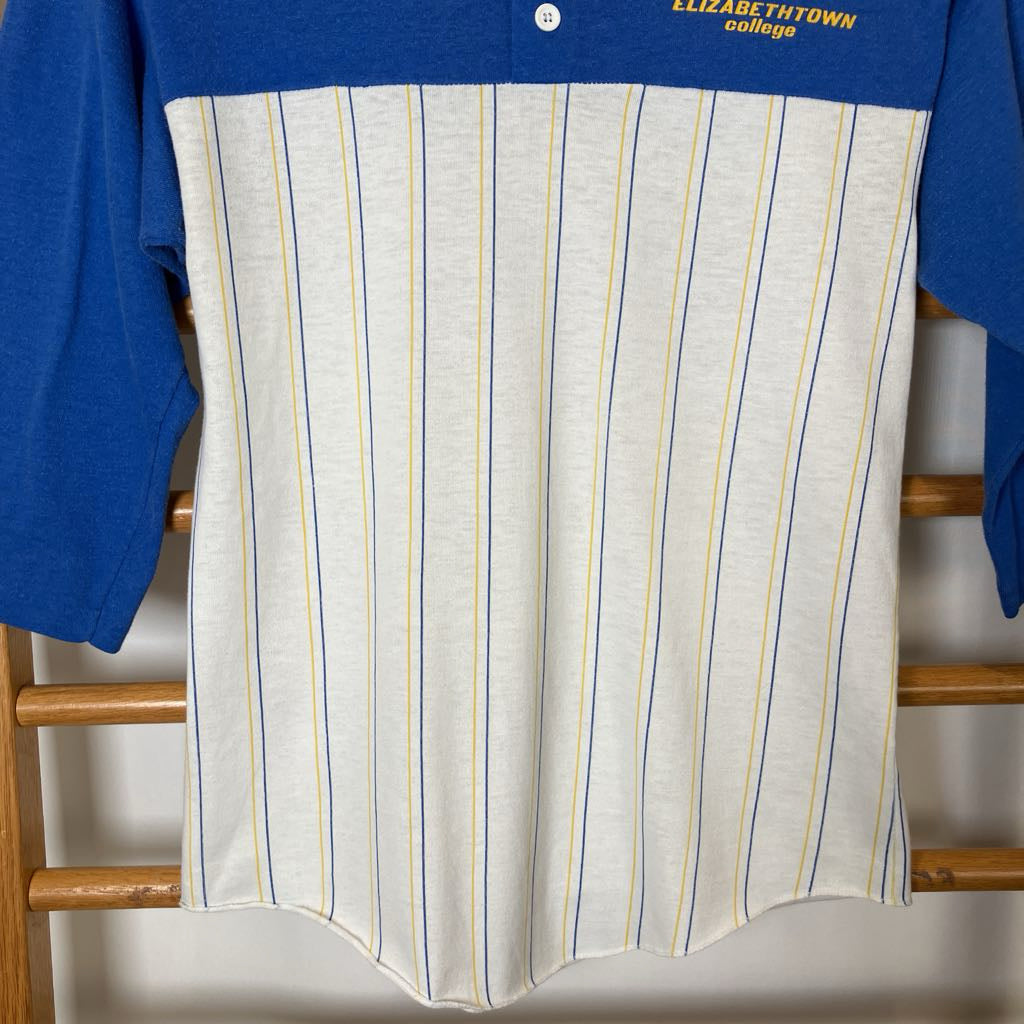 Striped shirt with blue collar and 'Elizabethtown College' text on a wooden rack.