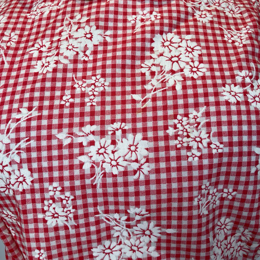 Red and white checkered fabric with floral patterns