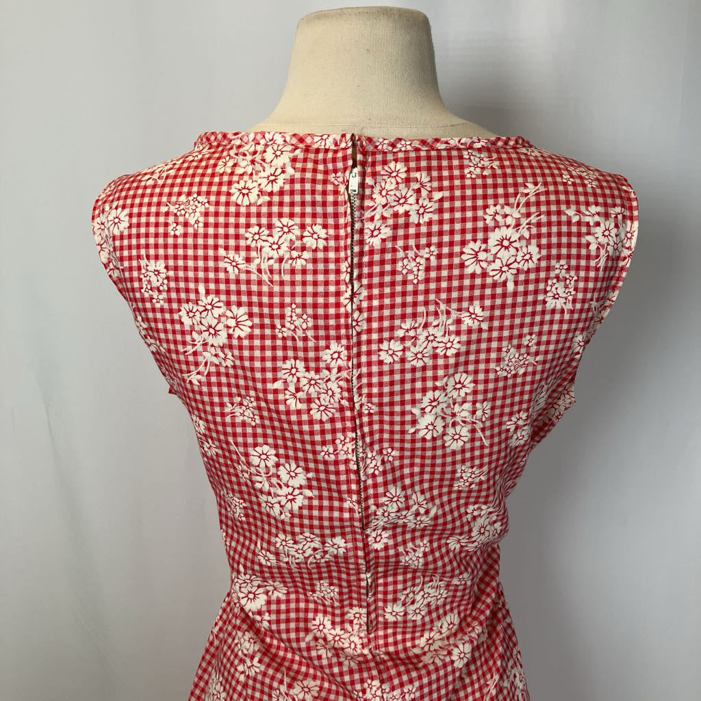 Closeup of the back of the red and white checkered dress with white background