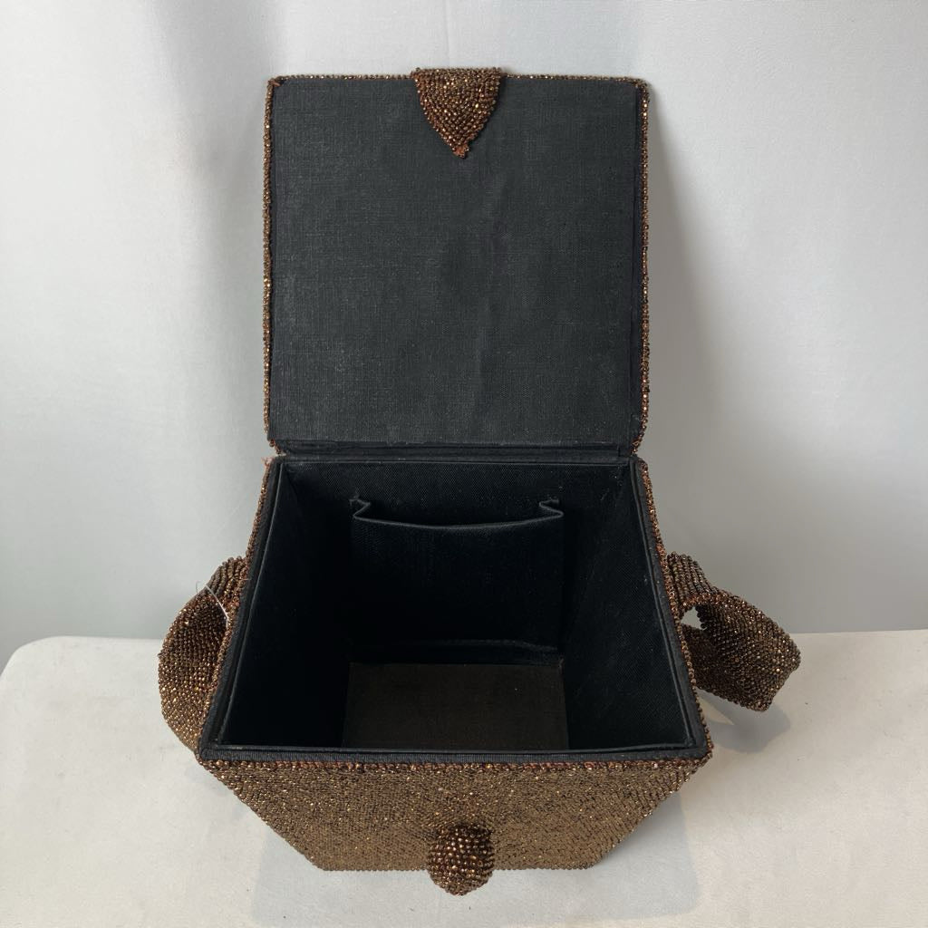 Decorative box with brown beaded exterior and black interior on a white surface.