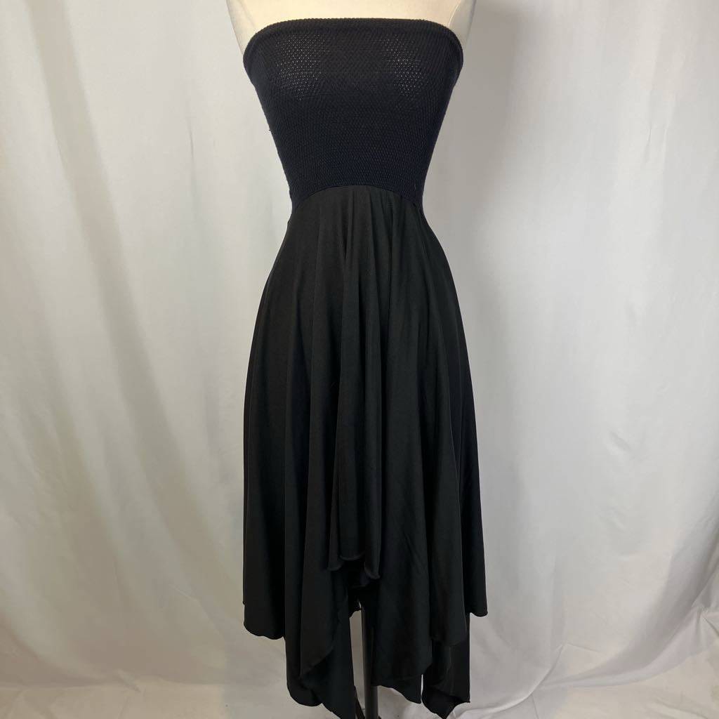 Black strapless dress on a mannequin against a white background