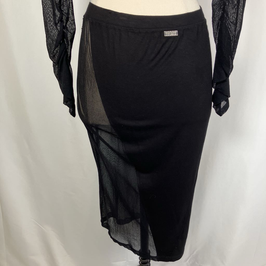 Black sheer skirt on a mannequin against a white background