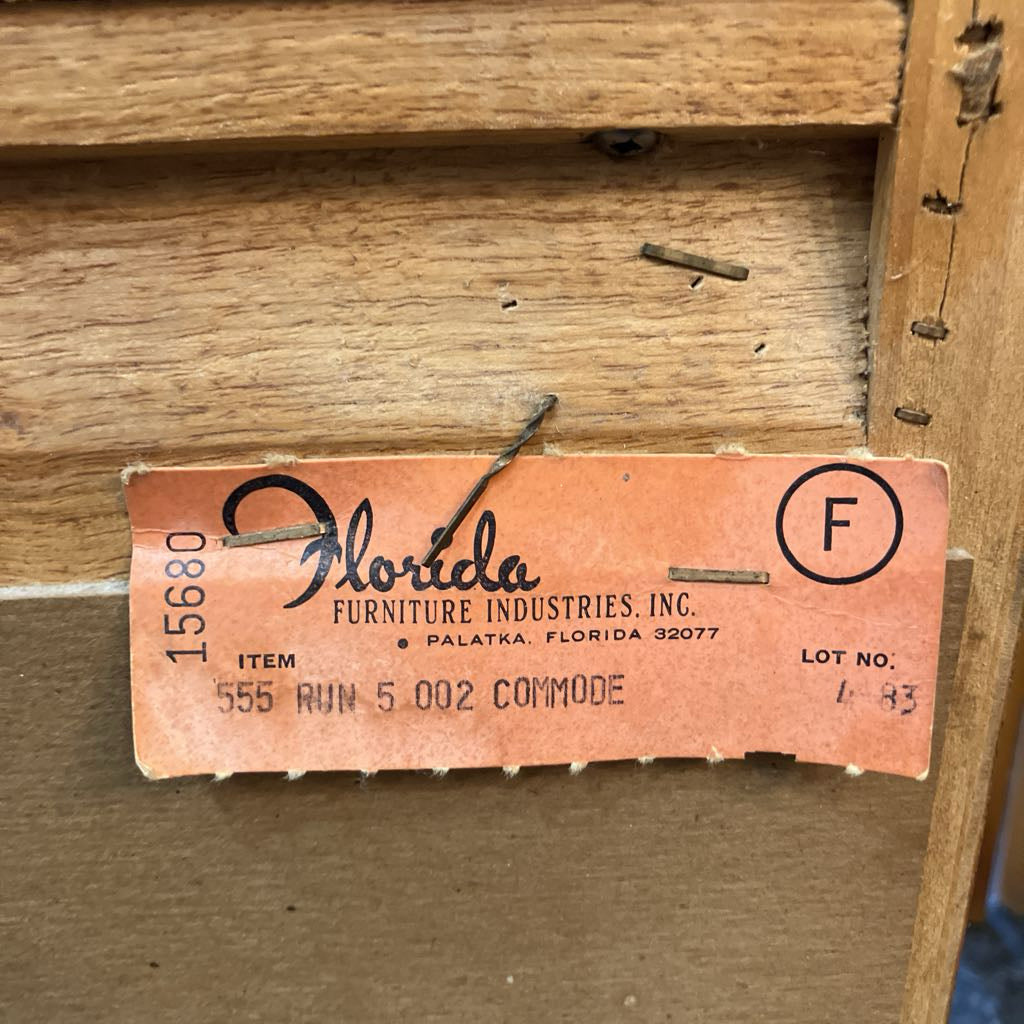 Wooden furniture with a label from Florida Furniture Industries, Inc.