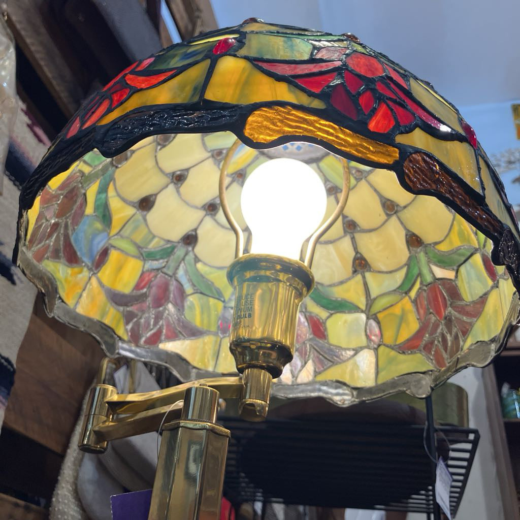 Stained glass lamp with floral design and gold fixture