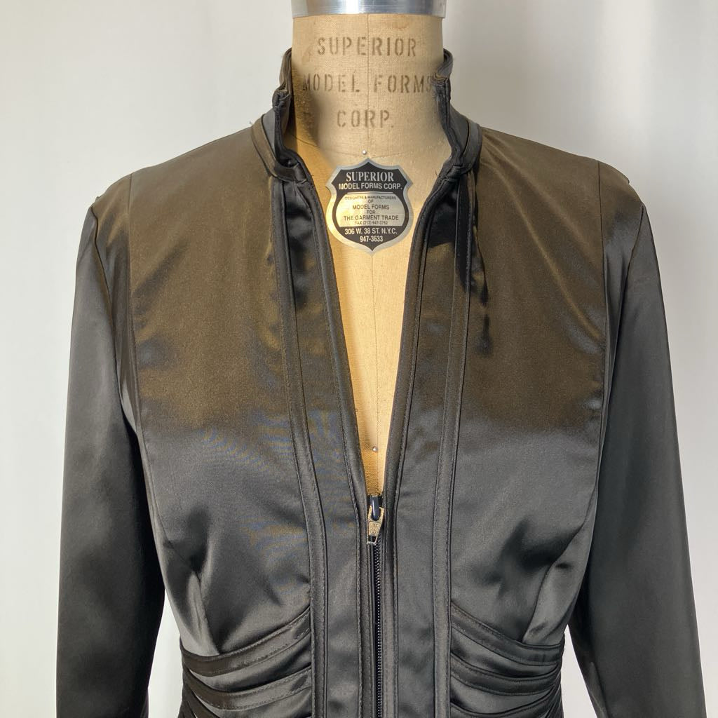 Brown and black jacket on a mannequin with 'Superior Model Forms Corp.' label.