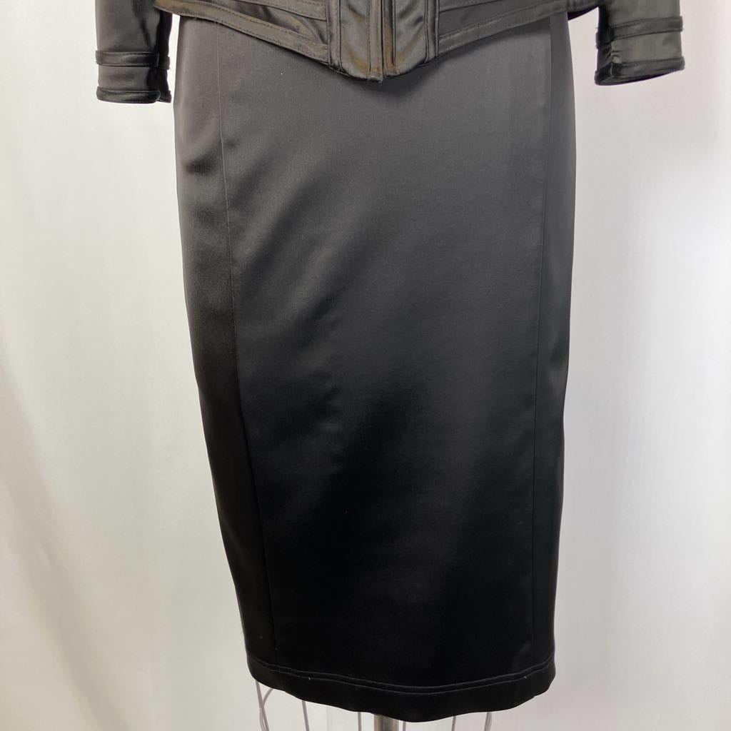 Black pencil skirt on a mannequin against a white background