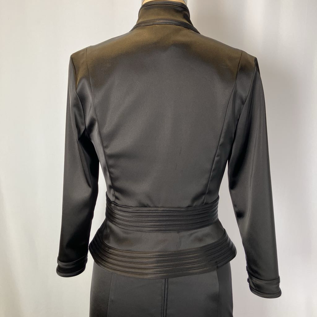 Black leather jacket on a mannequin against a white background