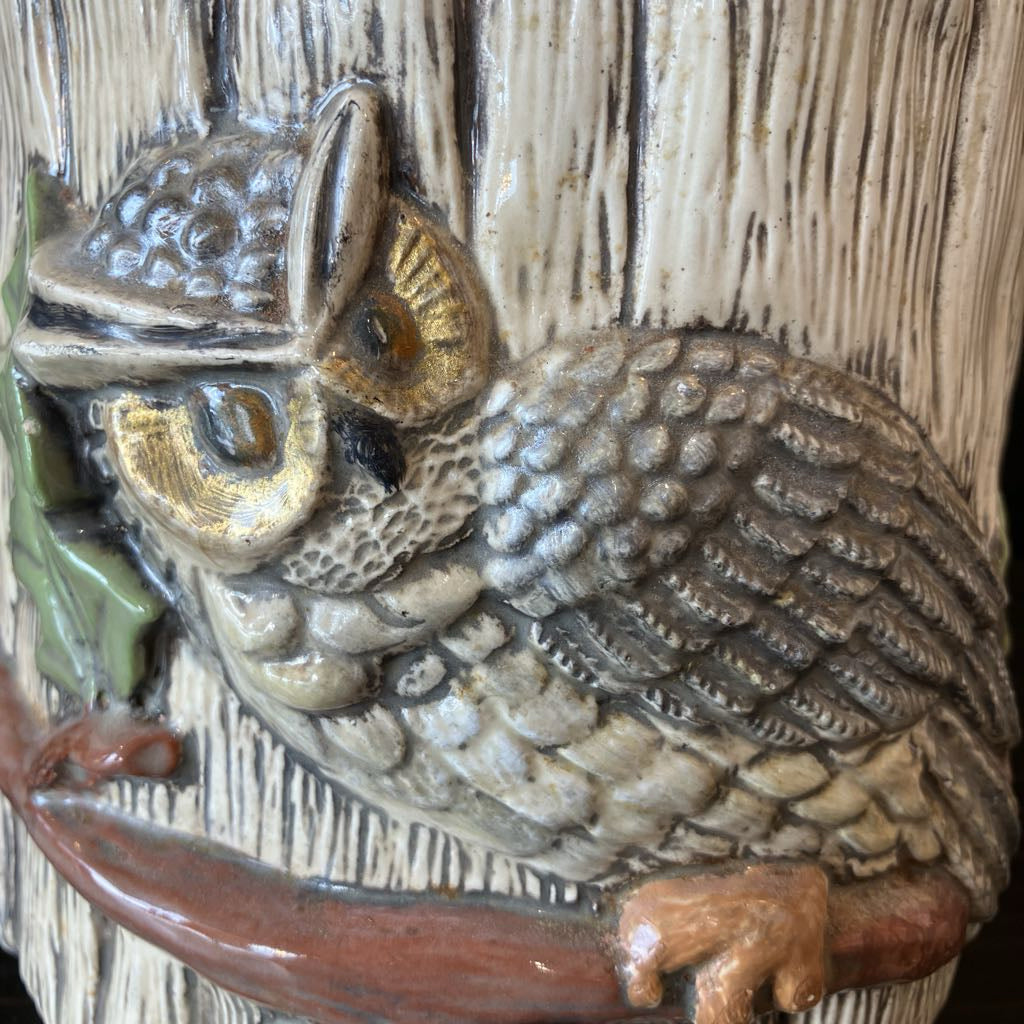 Decorative owl figure on a wooden background