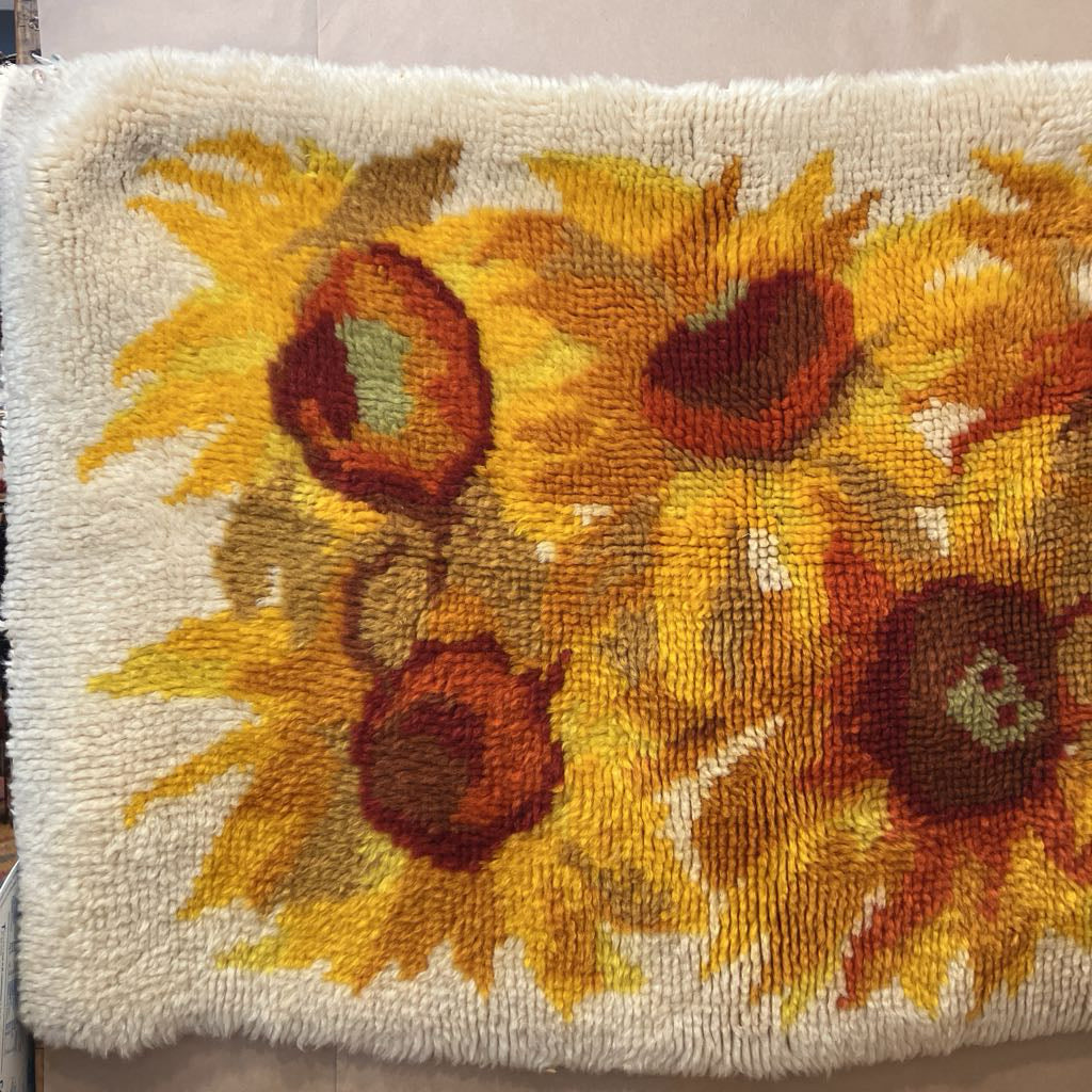 Decorative pillow with sunflower pattern on a white background