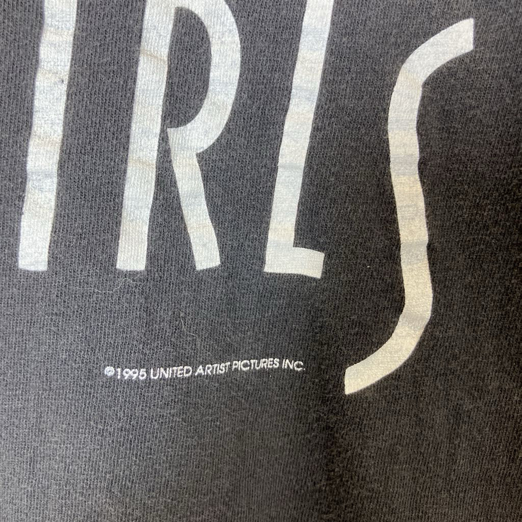 Black t-shirt with white text 'FILMS' and a logo on a dark background