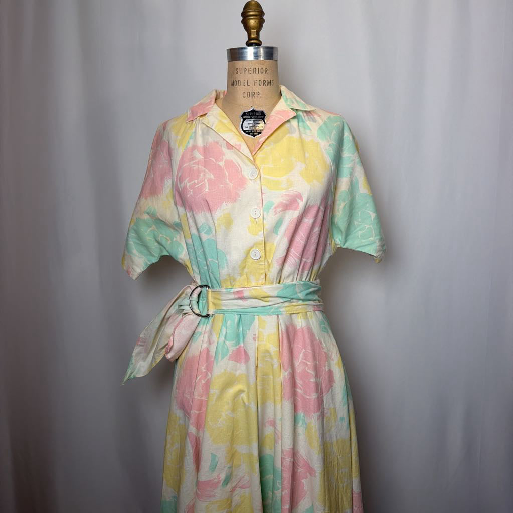Pastel floral dress on a mannequin against a plain background