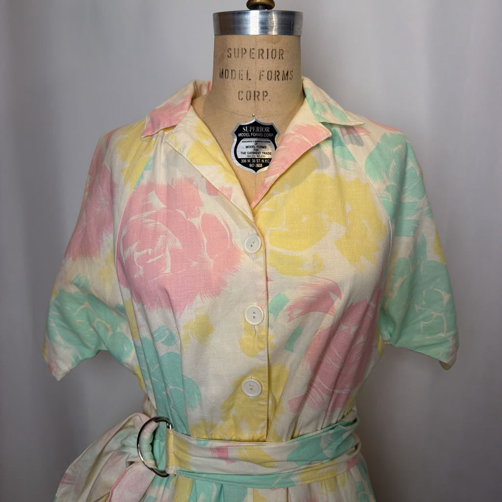 Pastel floral dress on a mannequin with 'Superior Model Forms Corp.' label against a gray background