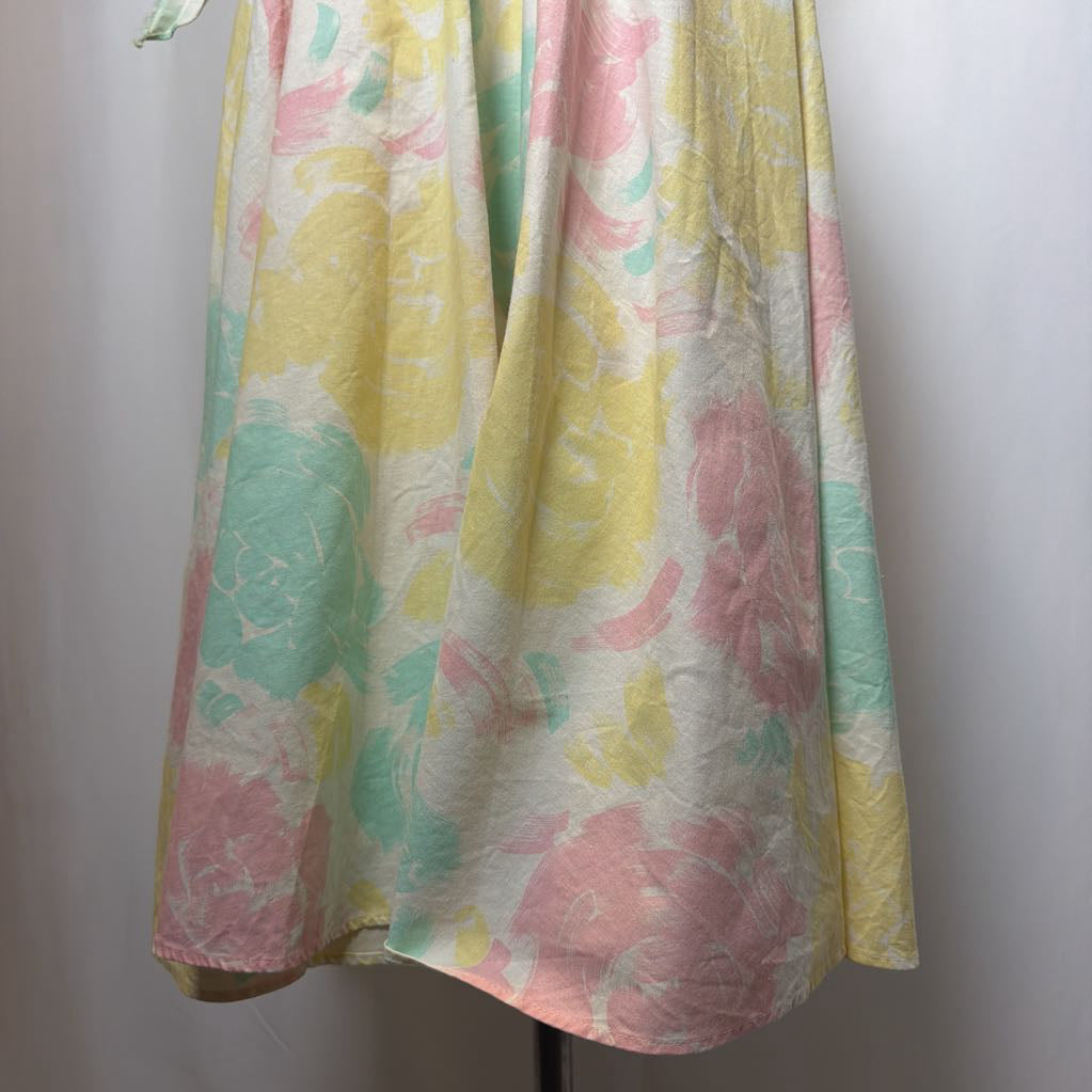 Colorful floral patterned fabric draped over a white background