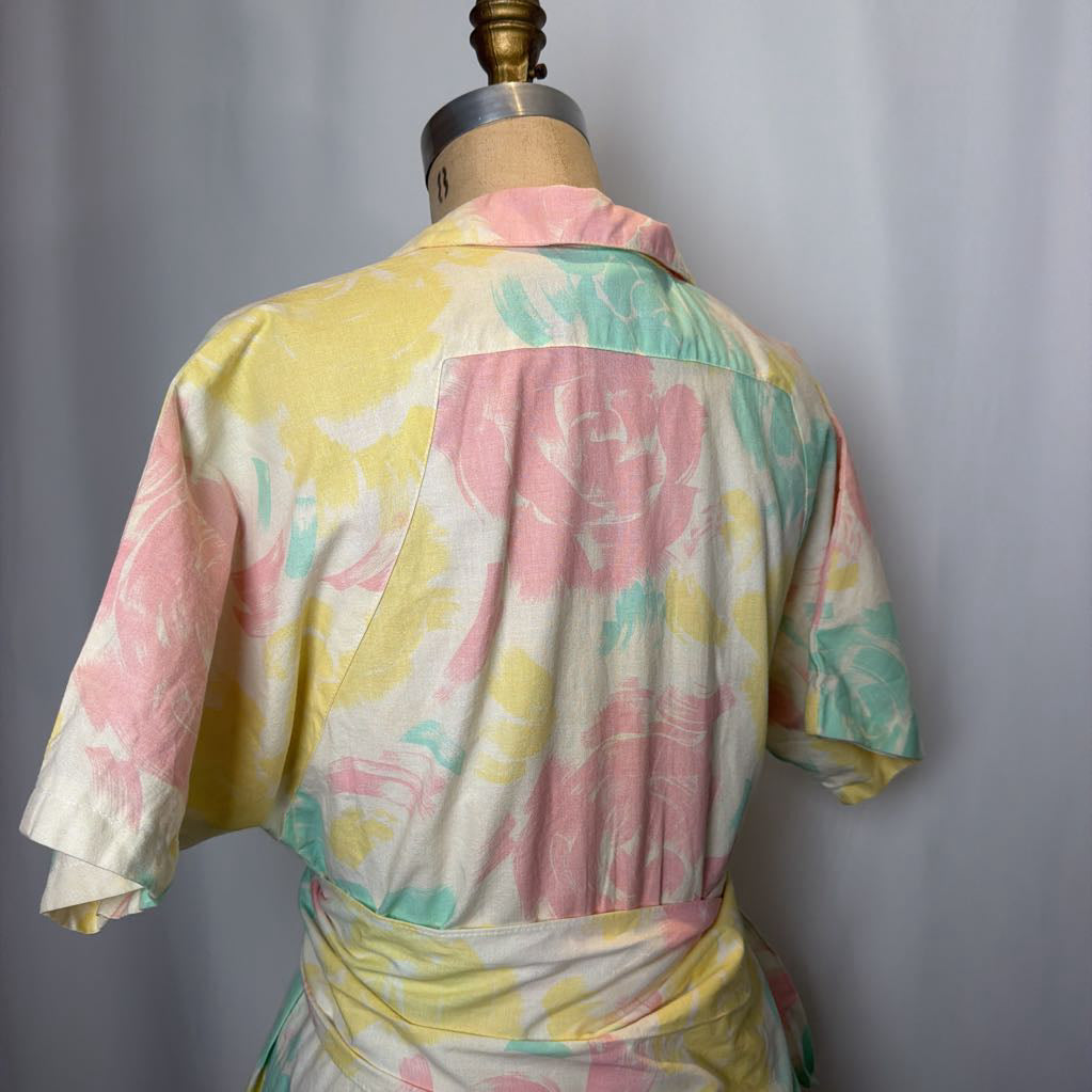 Pastel floral dress on a mannequin against a plain background