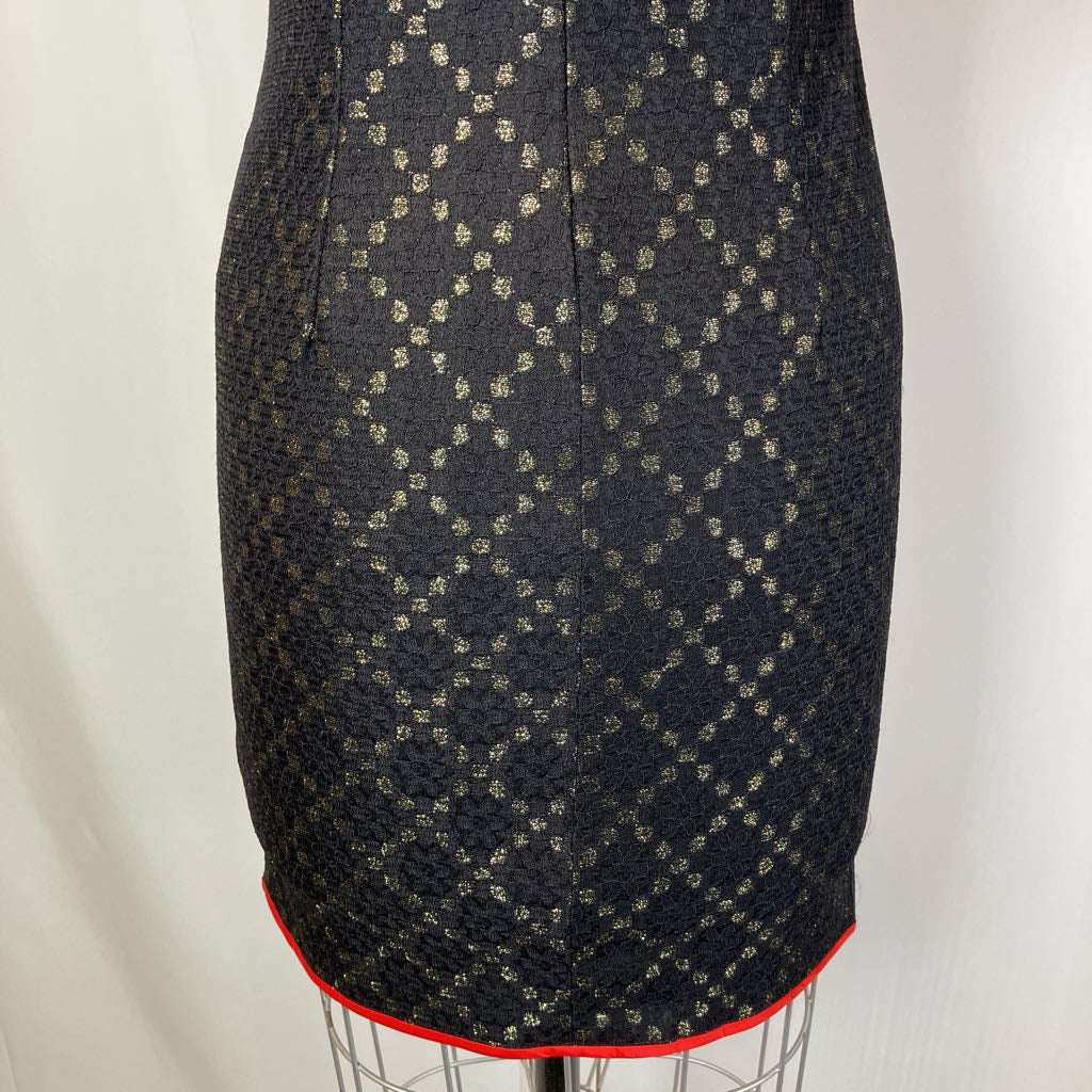 Black patterned skirt on a mannequin against a white background