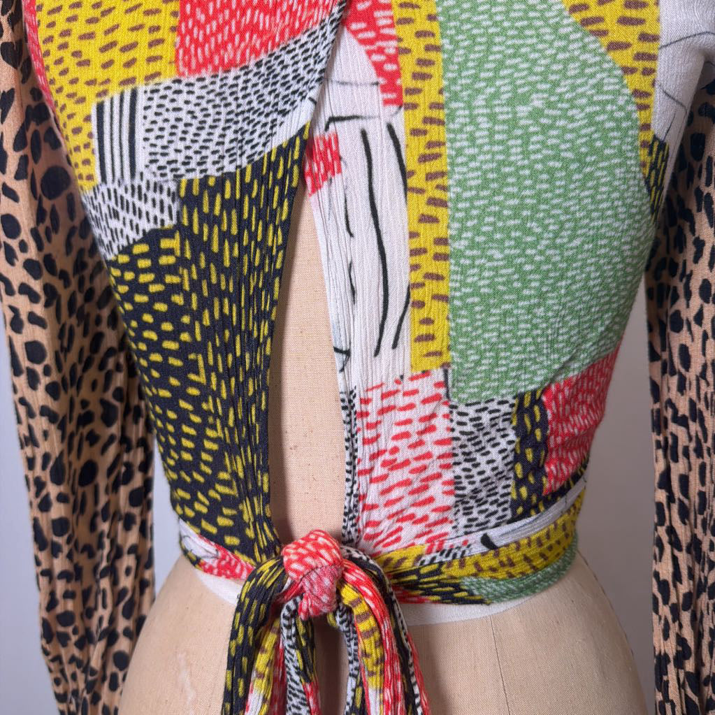 Colorful patterned fabric on a mannequin with leopard print accents.