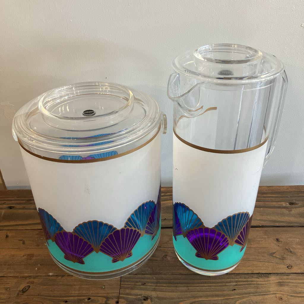 Two plastic containers with decorative patterns on a wooden surface.