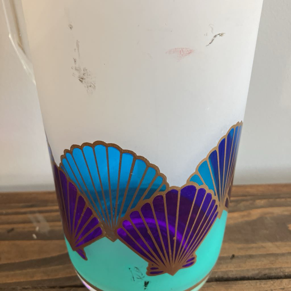 Decorative plastic with shell pattern on a wooden surface