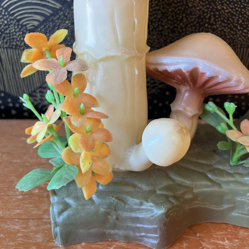 Decorative mushroom with flowers on a textured surface